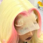 Woman wearing a blonde and pink ombre HD lace frontal wig, soft and voluminous human hair with natural curls, giving a confident and stylish look.