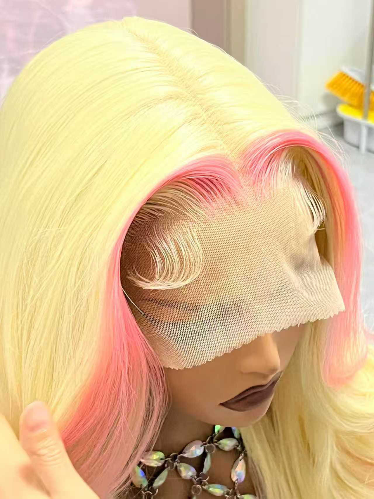 Woman wearing a blonde and pink ombre HD lace frontal wig, soft and voluminous human hair with natural curls, giving a confident and stylish look.
