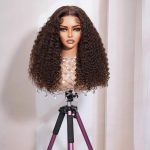 Mannequin wearing a long kinky curly human hair lace wig, natural brown color, 5x5 closure or 13x4 HD lace front option, 100% virgin hair
