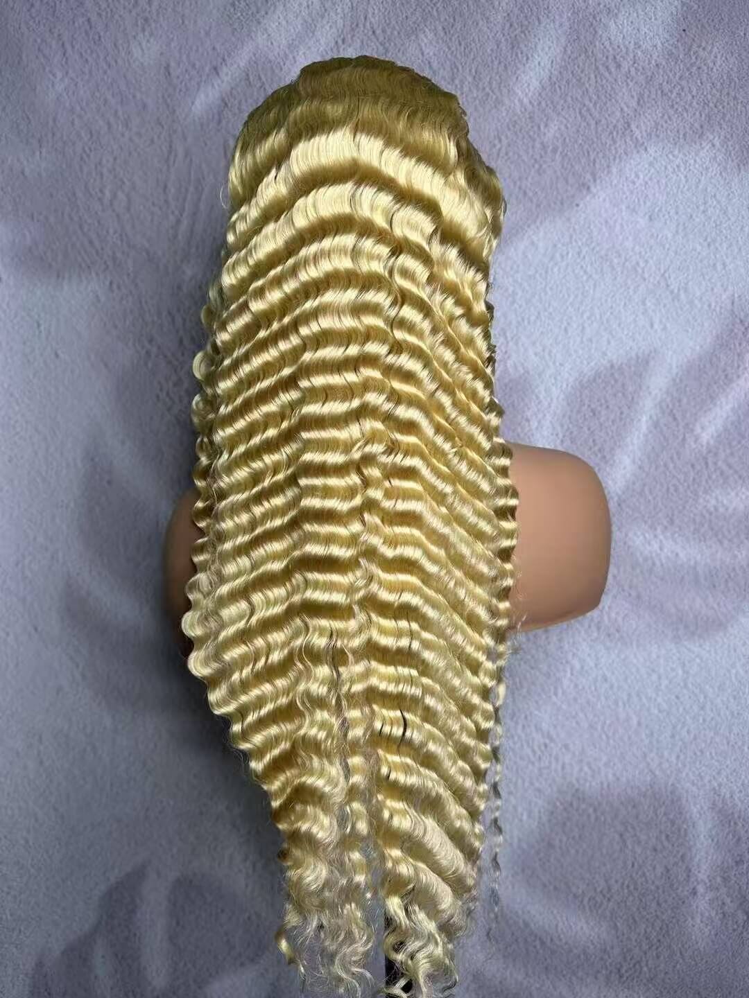 Back view of a 613 blonde pineapple-curly 13×4 HD lace frontal wig on a mannequin.